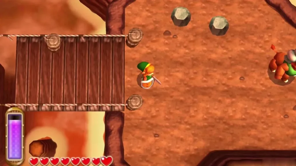 Link beside the rope bridge with an enemy on the ledge to the right Link beside the rope bridge with an enemy on the ledge to the right