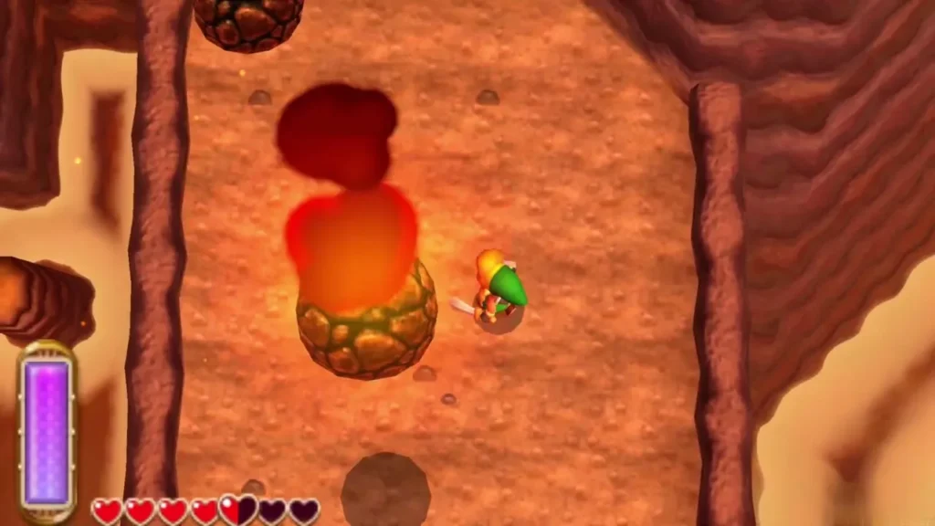 Link passing beside a flaming boulder on the open stretch of cliff Link passing beside a flaming boulder on the open stretch of cliff