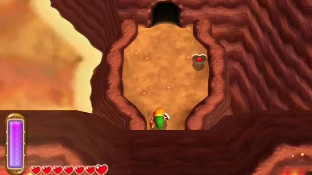 Link below a ledge where a Heart Piece sits, just outside the last cave on Death Mountain Link below a ledge where a Heart Piece sits, just outside the last cave on Death Mountain