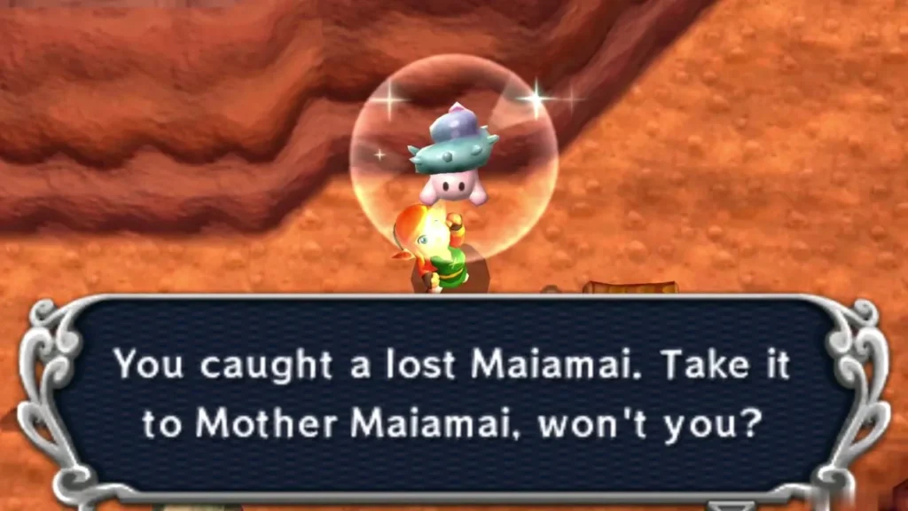 Link holding up a lost Maiamai on the cliff path, with the message box open Link holding up a lost Maiamai on the cliff path, with the message box open