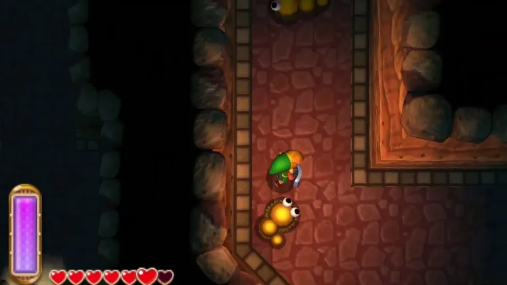 Link facing a Mini-Moldorm in a narrow stone passage inside the tunnel Link facing a Mini-Moldorm in a narrow stone passage inside the tunnel