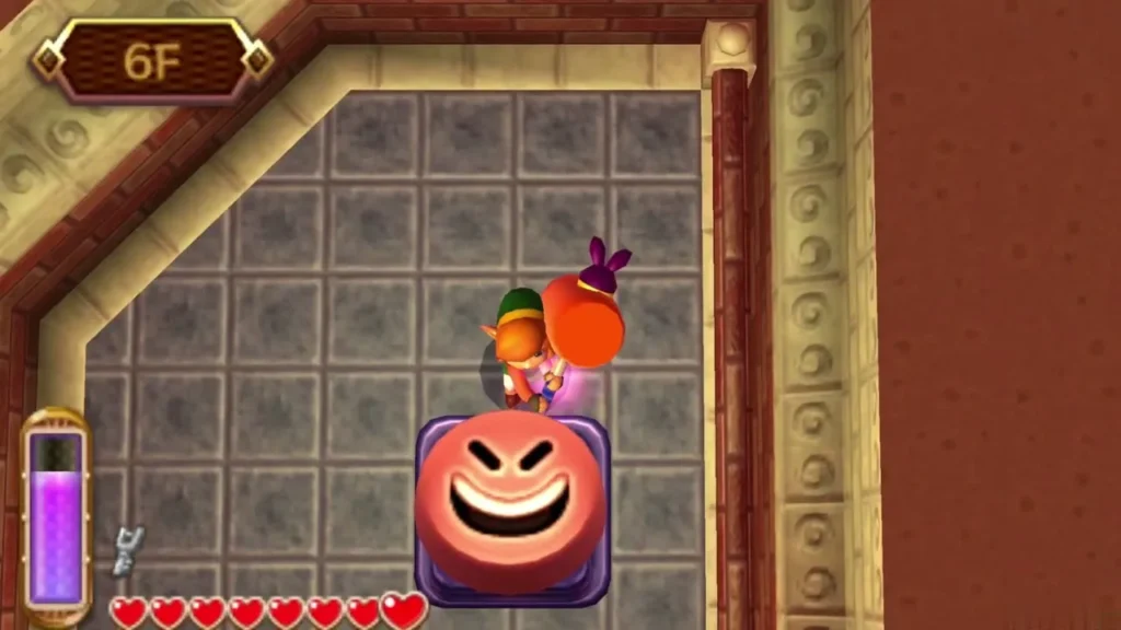Link bouncing off a grinning Mole on the 6F floor Link bouncing off a grinning Mole on the 6F floor