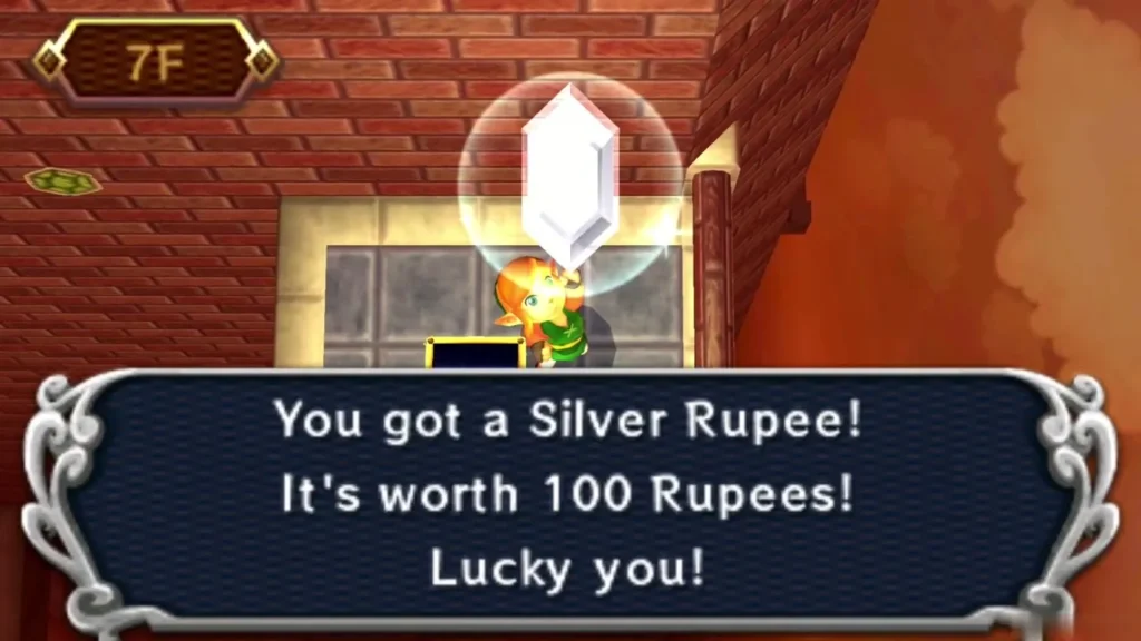 Link holding up a Silver Rupee, with the box reading worth 100 Rupees Link holding up a Silver Rupee, with the box reading worth 100 Rupees