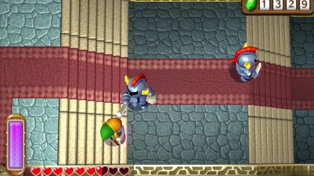 Link fighting armored soldiers on the third-floor red carpet beside a stone pillar