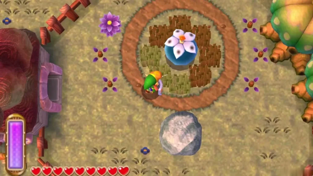 Link beside the Big Bomb Flower in its pot inside the fenced garden
