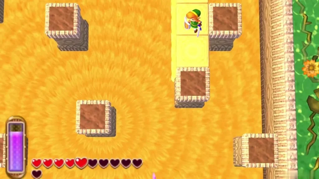 Link walks among sunken stone blocks on a sea of yellow sand, the sandy dungeon floor stretching ahead