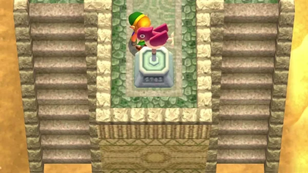 Link beside the pink-bird Weather Vane on a stone pedestal at the top of a long stone stair in the desert