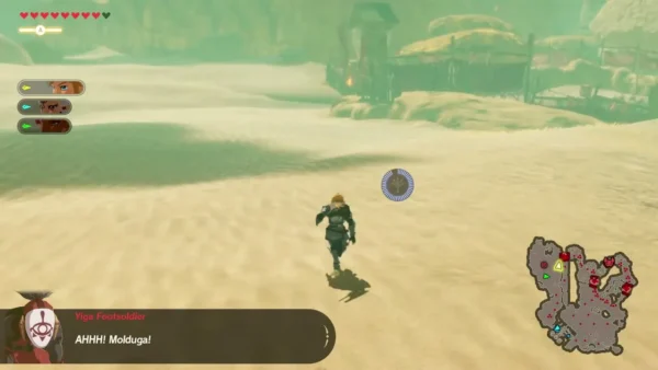 A Yiga Footsoldier shouts that the Molduga is coming as Link runs across the sand A Yiga Footsoldier shouts that the Molduga is coming as Link runs across the sand