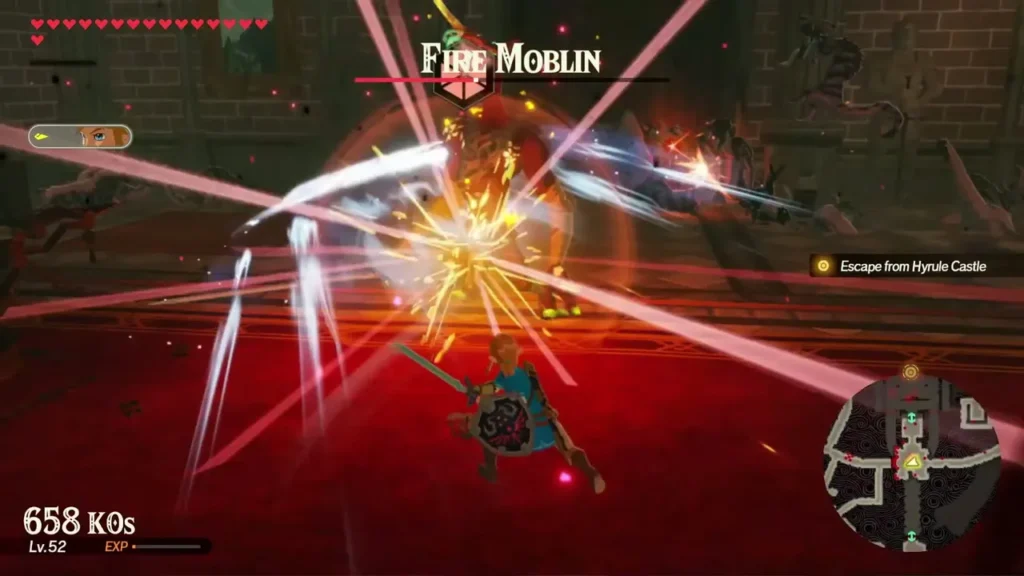 Link fights a Fire Moblin in a red-carpeted castle hall with its name shown at the top