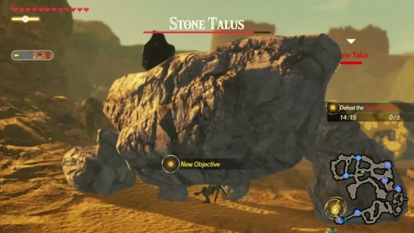 A Stone Talus with its name bar at the top of the screen beside the Defeat the Stone Taluses objective