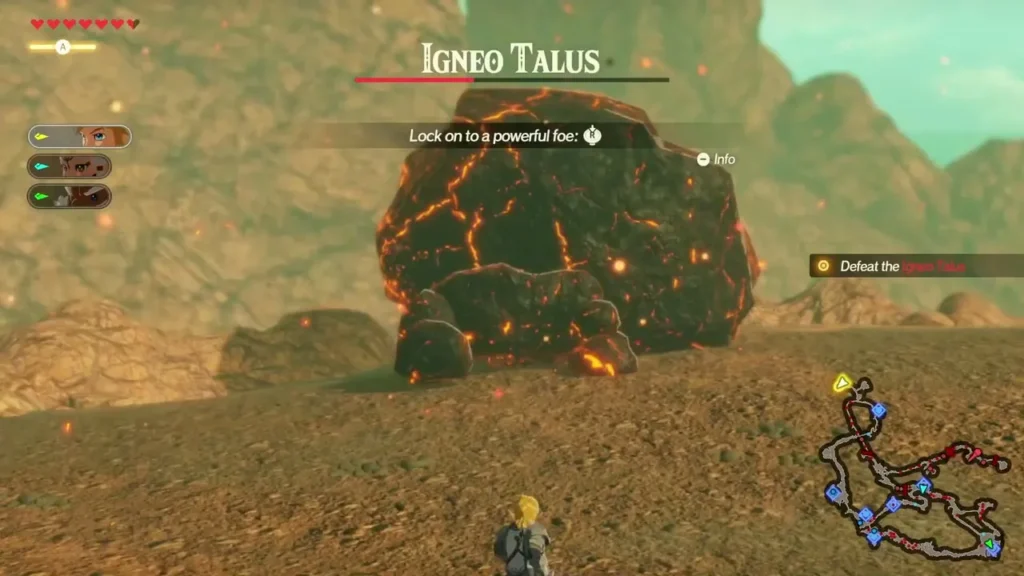 Link faces an Igneo Talus, a lava rock monster, with the lock-on prompt and the Defeat the Igneo Talus objective Link faces an Igneo Talus, a lava rock monster, with the lock-on prompt and the Defeat the Igneo Talus objective