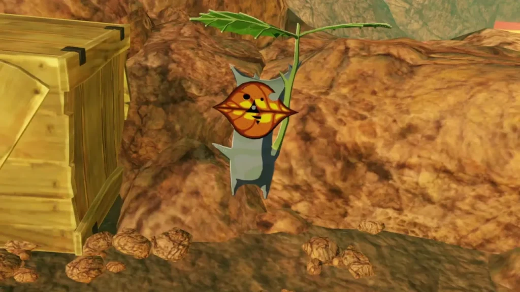 A Korok with an orange face stands beside a wooden crate on the left side of the climb path A Korok with an orange face stands beside a wooden crate on the left side of the climb path