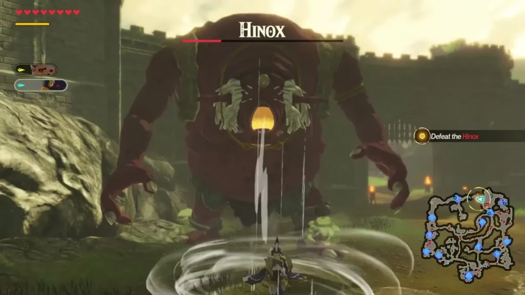 The Hinox fight, with its health bar and the Defeat the Hinox objective on screen The Hinox fight, with its health bar and the Defeat the Hinox objective on screen
