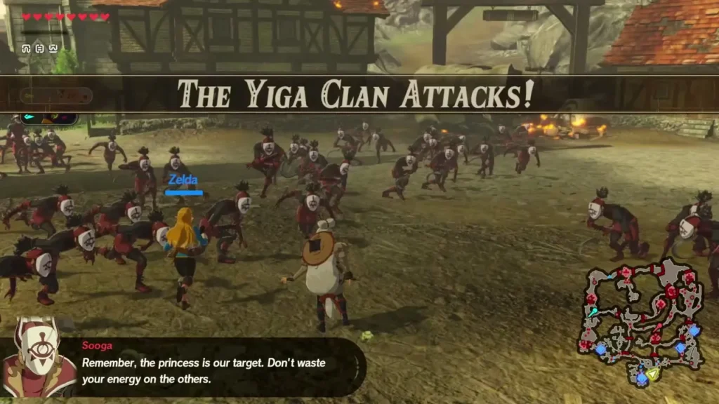 Zelda, marked by her name label, is the controlled character as The Yiga Clan Attacks! banner appears in the village Zelda, marked by her name label, is the controlled character as The Yiga Clan Attacks! banner appears in the village