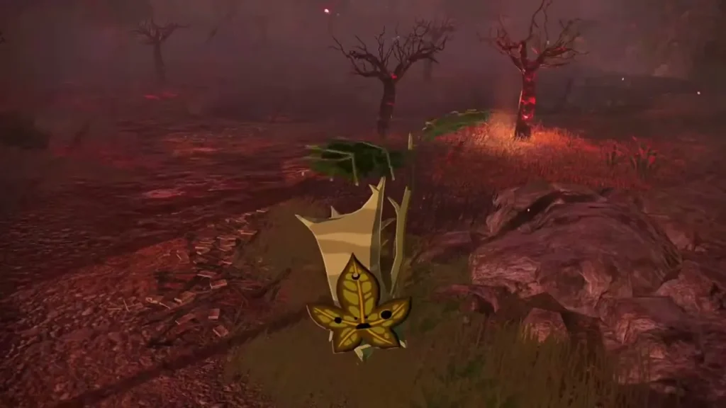 A small Korok with a leaf mask stands in the burnt grass after the balloon is hit