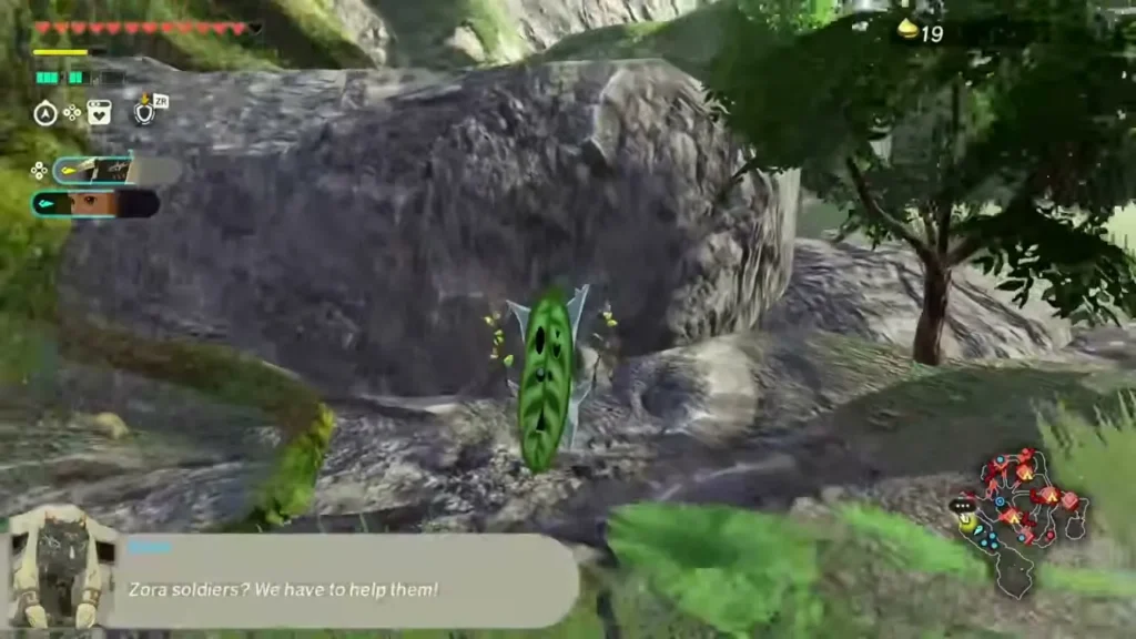 A Korok stands at the foot of a boulder beside a tree after the pinwheel is spun