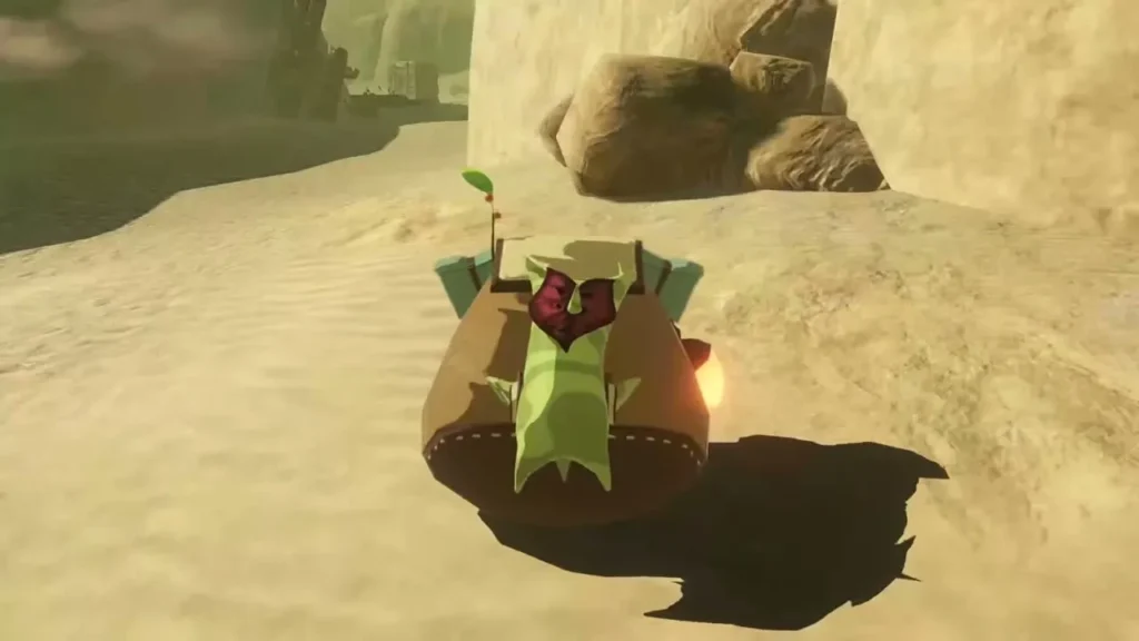 A Korok peeks out of the broken crate on the sand road