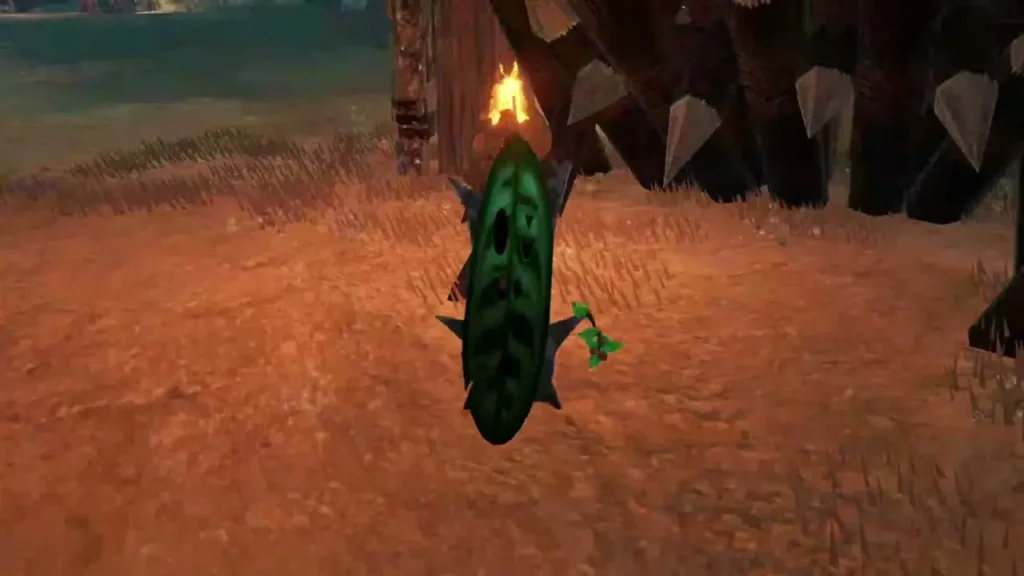 A Korok stands beside a torch pole at an outpost's spiked gate A Korok stands beside a torch pole at an outpost's spiked gate