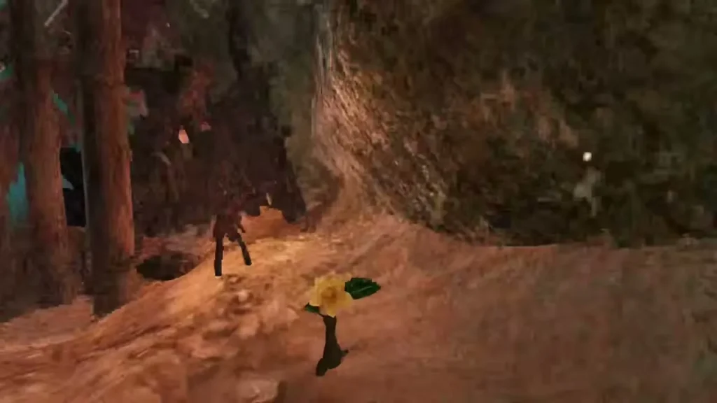 A yellow flower grows in the dirt beside an outpost gate A yellow flower grows in the dirt beside an outpost gate