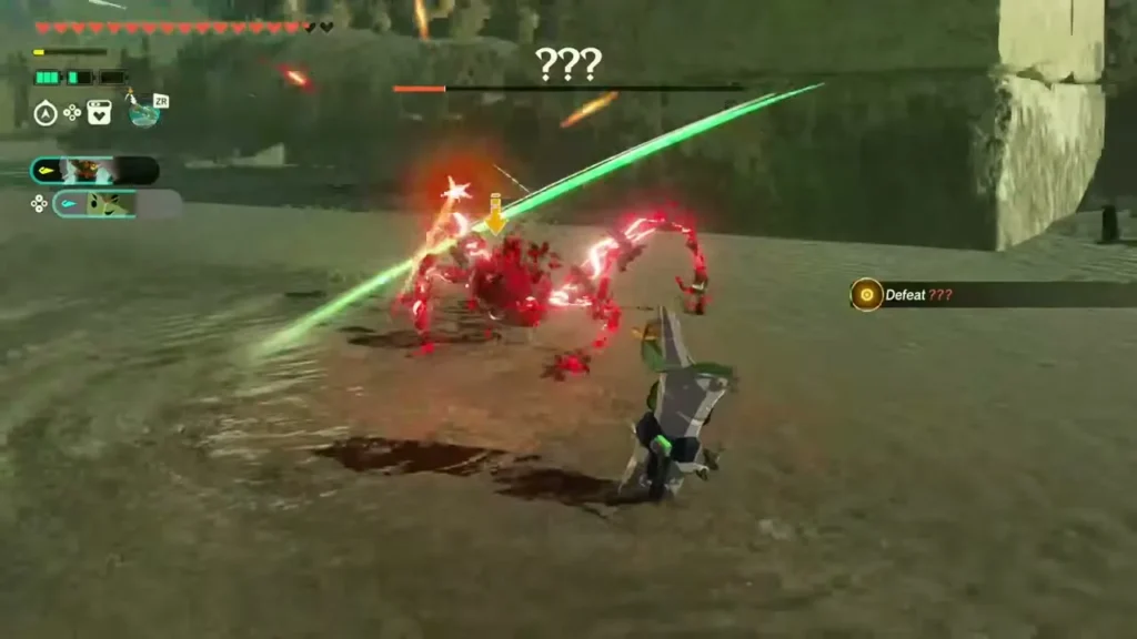The Construct slashes the red boss as it scuttles in across the sand