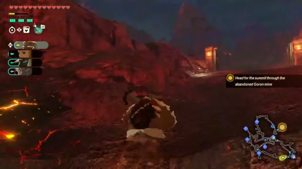 Zelda's party runs down a dark road toward a gate in the south of Death Mountain