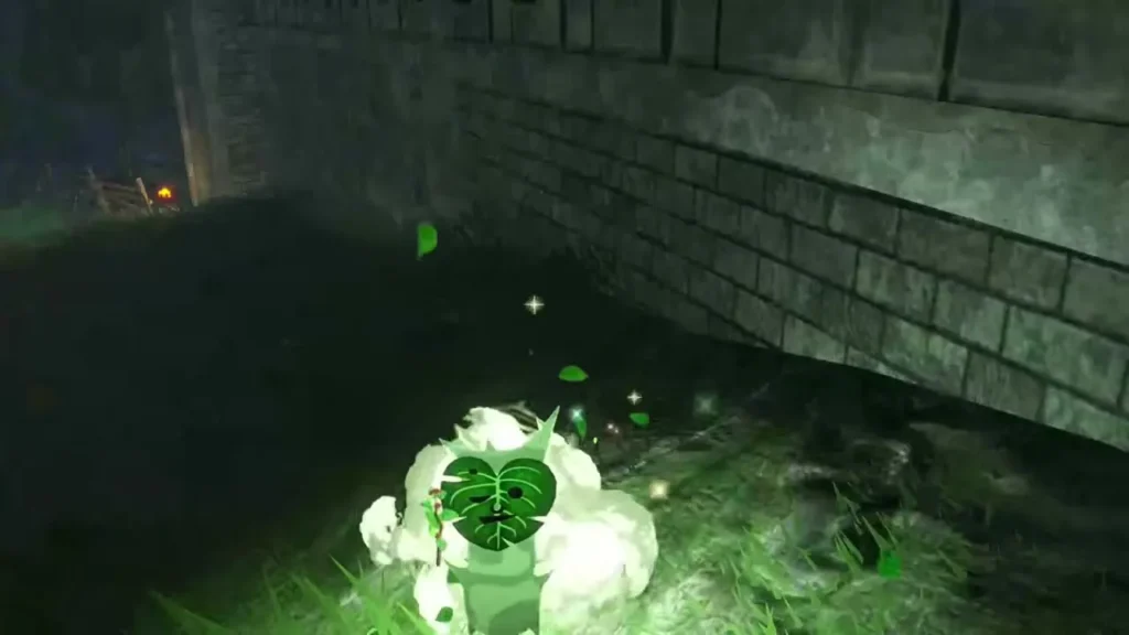 A Korok bursts out in a puff of smoke beside the stone wall