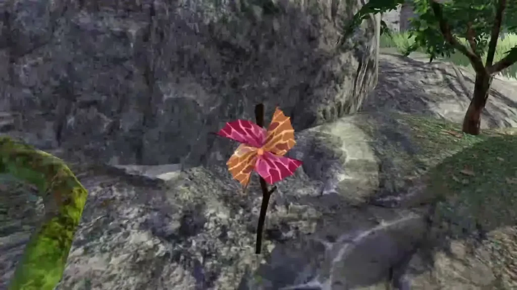 A red pinwheel stands against a large rock near a tree A red pinwheel stands against a large rock near a tree