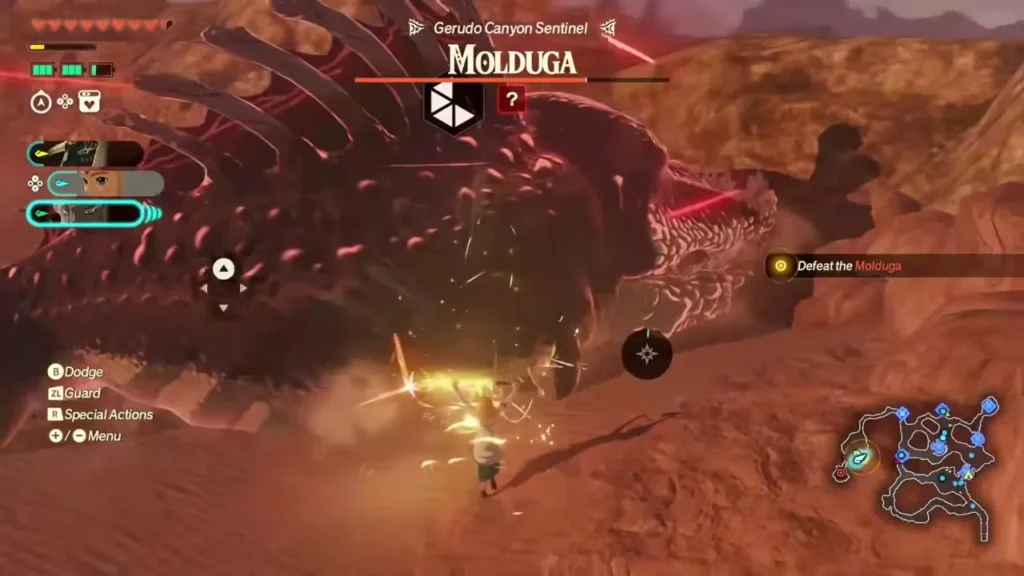 The Molduga lunges across the sand with its name bar at the top of the screen The Molduga lunges across the sand with its name bar at the top of the screen