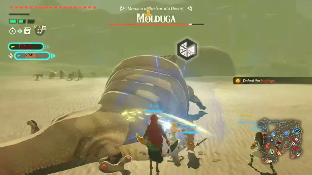Ardi and allies attack the Molduga as it lies stunned in the sand Ardi and allies attack the Molduga as it lies stunned in the sand