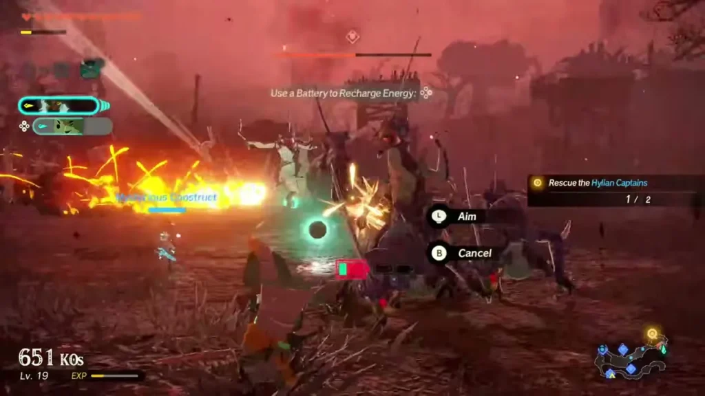 Zelda aims a device with the Aim and Cancel prompts and a battery tip on screen Zelda aims a device with the Aim and Cancel prompts and a battery tip on screen