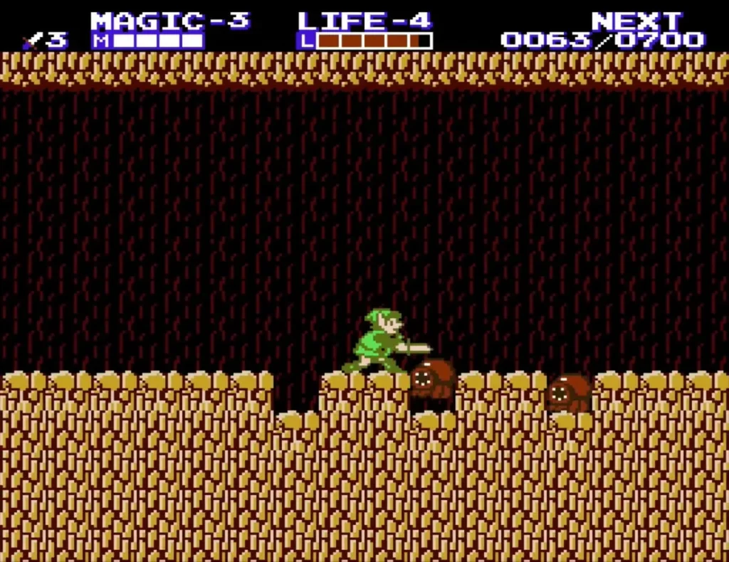 Link in a brown rock cave with a brown enemy at the right and the Life meter at the top Link in a brown rock cave with a brown enemy at the right and the Life meter at the top