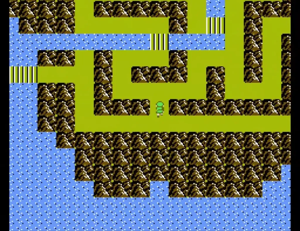 Overhead view of Link on a grassy path between rocky walls and water on Maze Island Overhead view of Link on a grassy path between rocky walls and water on Maze Island