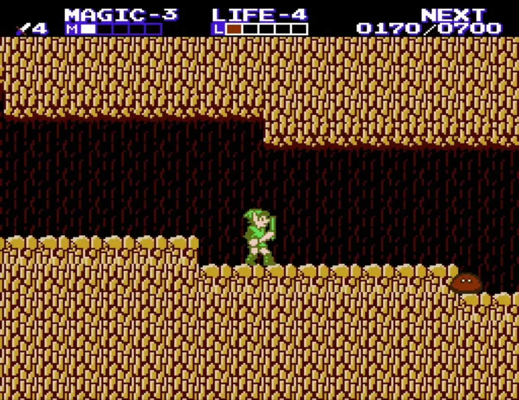 Link in the brown cave with Attack level 4 shown on the HUD after the level-up