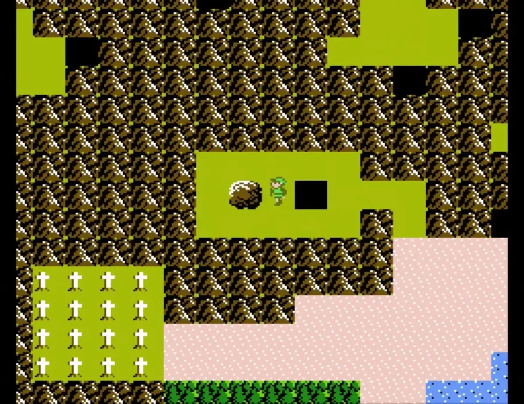 Overhead view of Link standing beside a brown boulder on the overworld near the pit