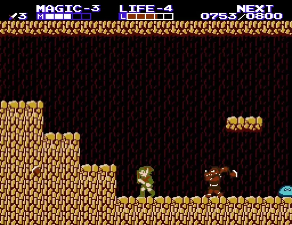 Link on a rock step in the brown cave with a red Daira approaching from the right