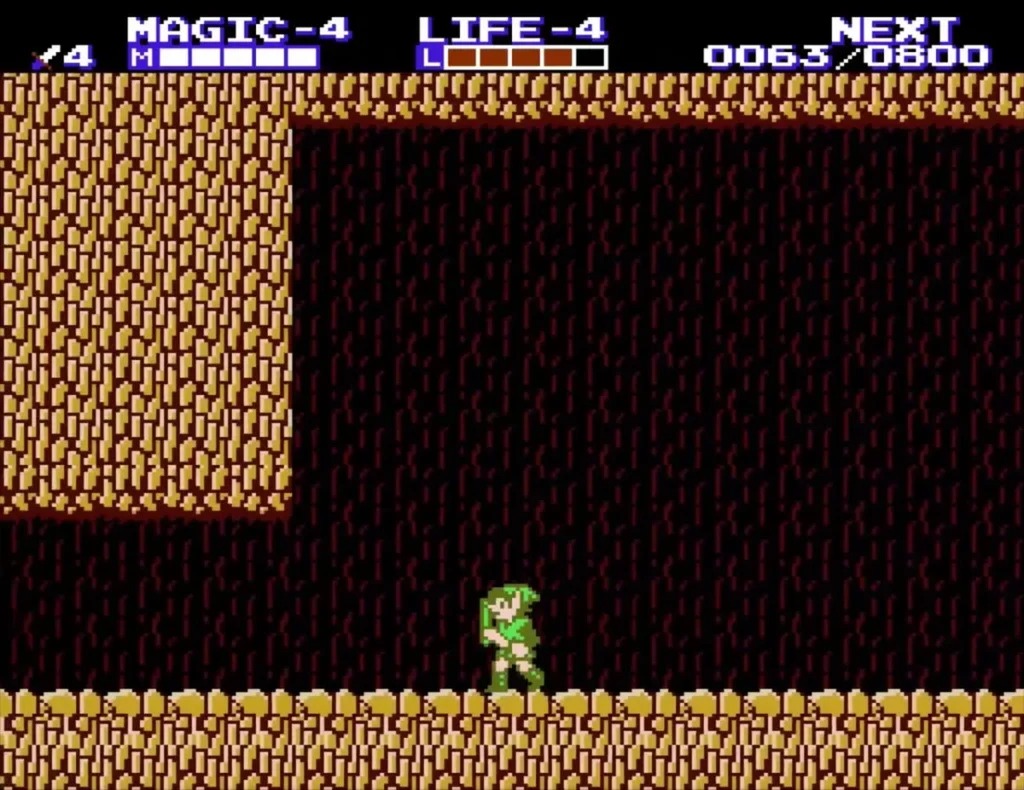 Link standing in a dark cave on Death Mountain with Magic level 4 shown on the HUD