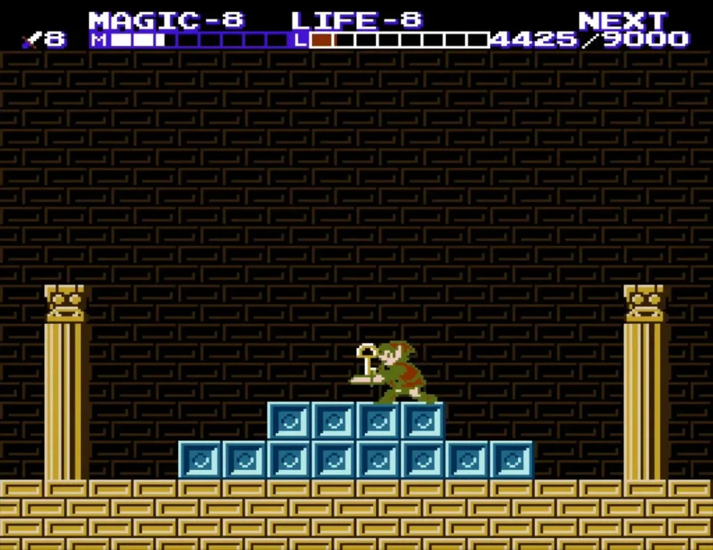 Link holding up a small gold key on the ice blocks after Thunderbird falls