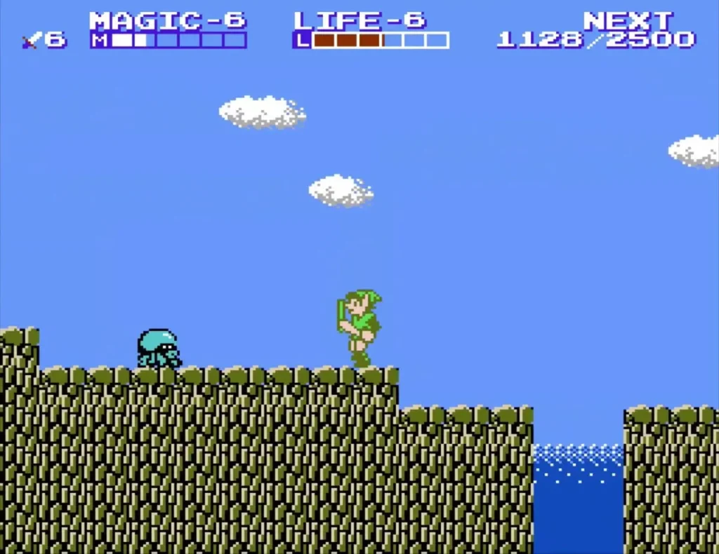 Link on a grass ledge with a cyan enemy beside him and water below the ledge