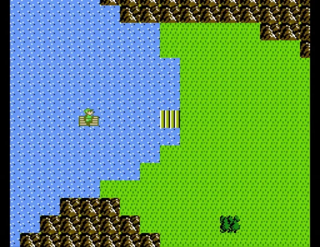 Overhead view of a blue lake on the left and a green field east of it