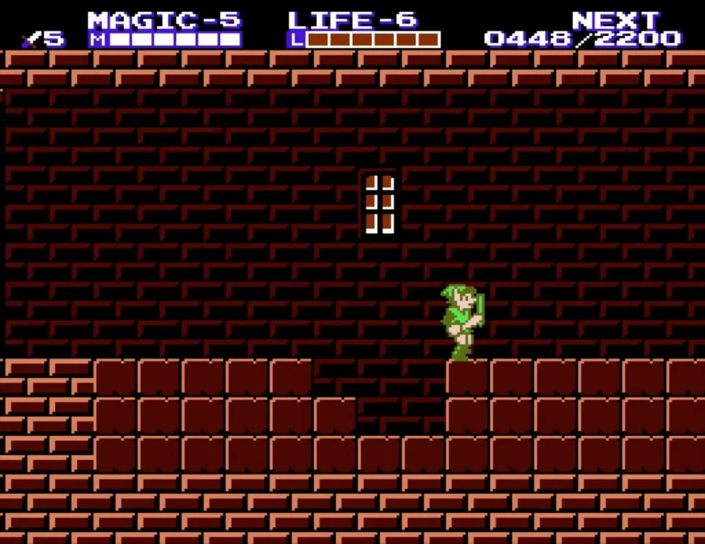 Link on a brick ledge beside a gap where bricks were broken in Island Palace