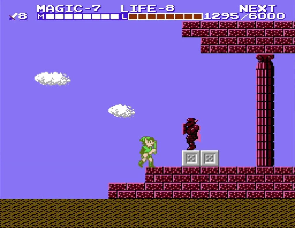 Link among red pillars and grey blocks at the entrance of Three-Eye Rock Palace