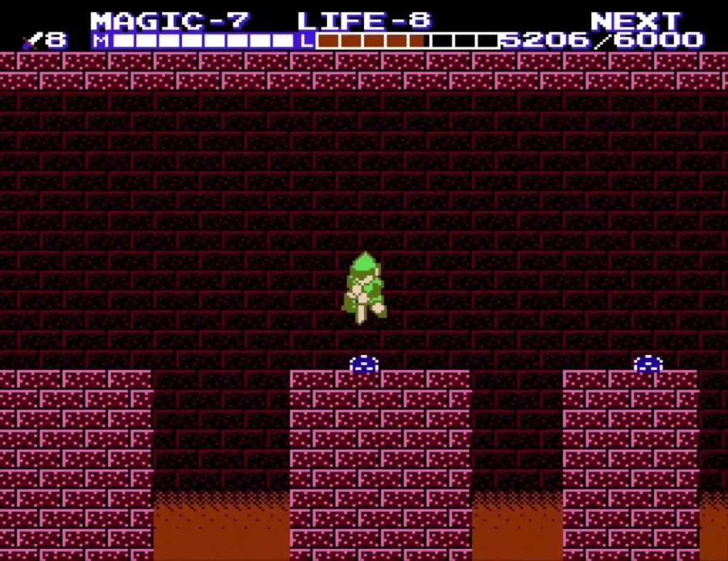 Link on stone ledges above a lava strip, with small blue bat enemies