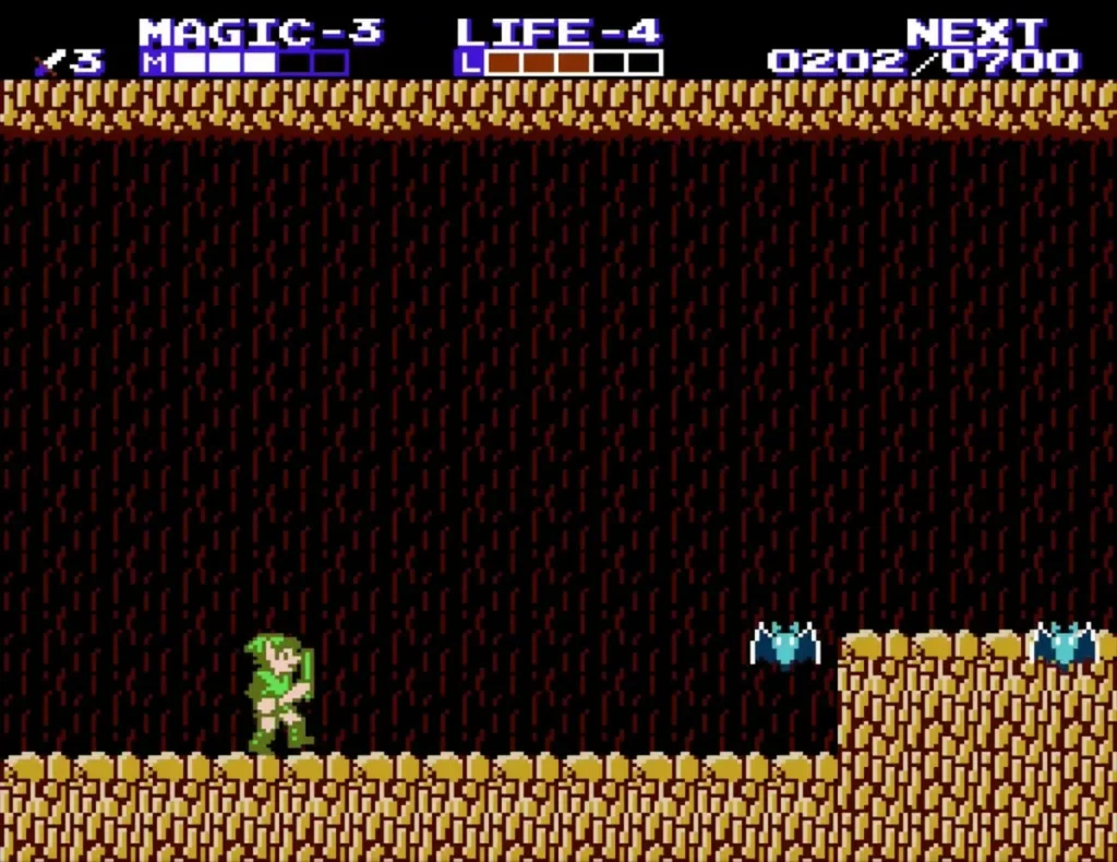 Two flying bats near a cave ledge as Link walks the floor Two flying bats near a cave ledge as Link walks the floor