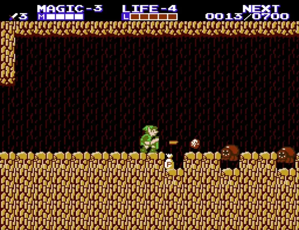 Link facing brown enemies on the floor of the brown rock cave Link facing brown enemies on the floor of the brown rock cave