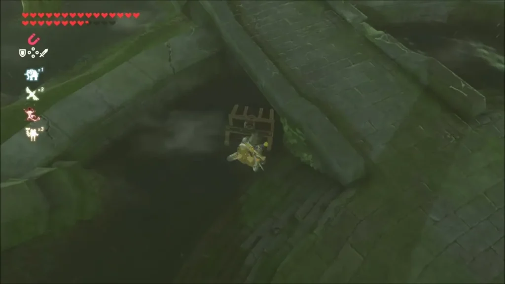 Link pulling the chest out of the rubble with Magnesis Link pulling the chest out of the rubble with Magnesis
