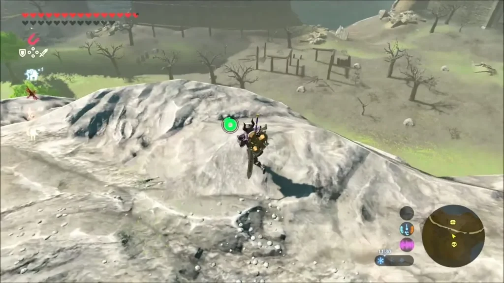 Link gliding toward the burnt Castle Town Prison ruins Link gliding toward the burnt Castle Town Prison ruins