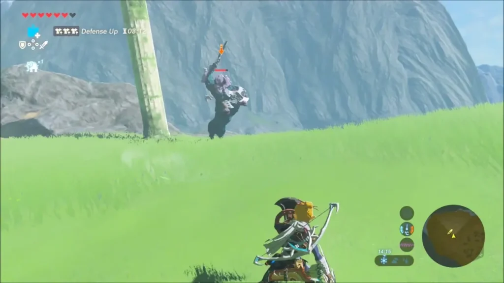 Link with a Defense Up buff watching a Lynel rear up on a distant grassy hill Link with a Defense Up buff watching a Lynel rear up on a distant grassy hill