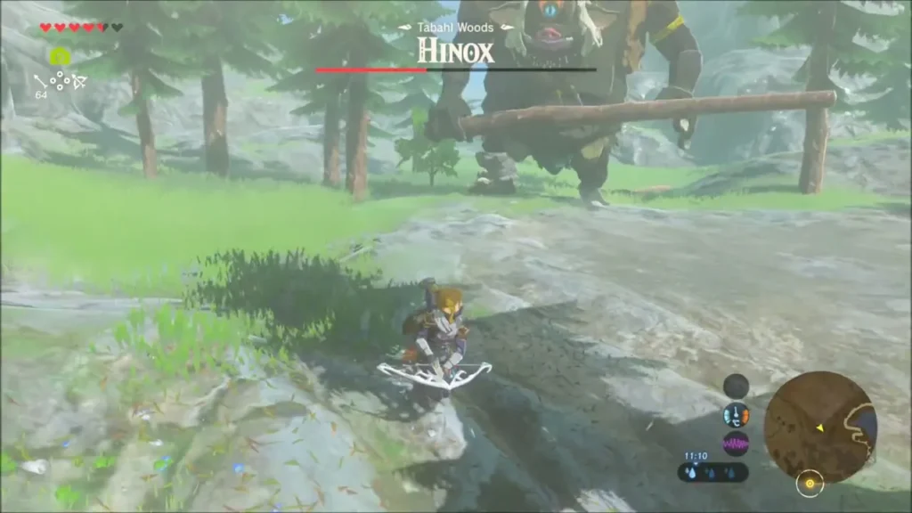 Hinox lifting a tree trunk while Link keeps his distance Hinox lifting a tree trunk while Link keeps his distance