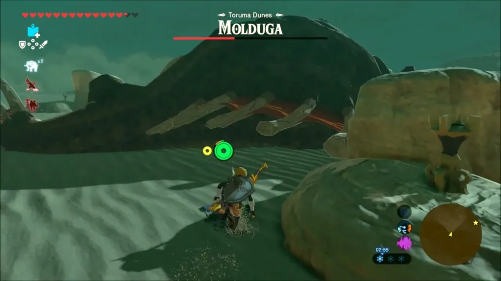 Stunned Molduga lying on the sand with its ribs exposed as Link approaches Stunned Molduga lying on the sand with its ribs exposed as Link approaches