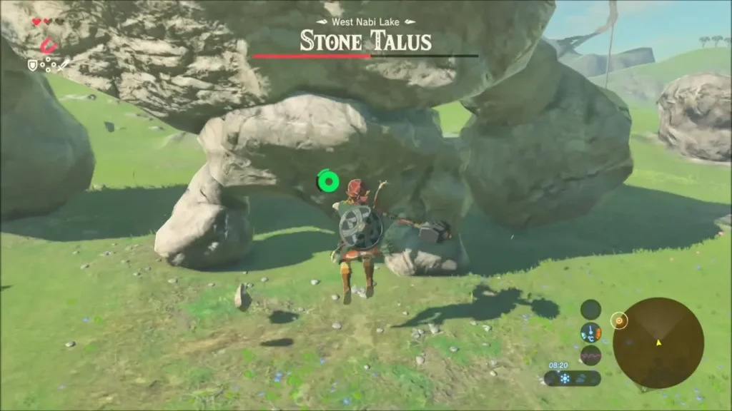 Link clinging to the underside of a Stone Talus with a hammer in hand Link clinging to the underside of a Stone Talus with a hammer in hand